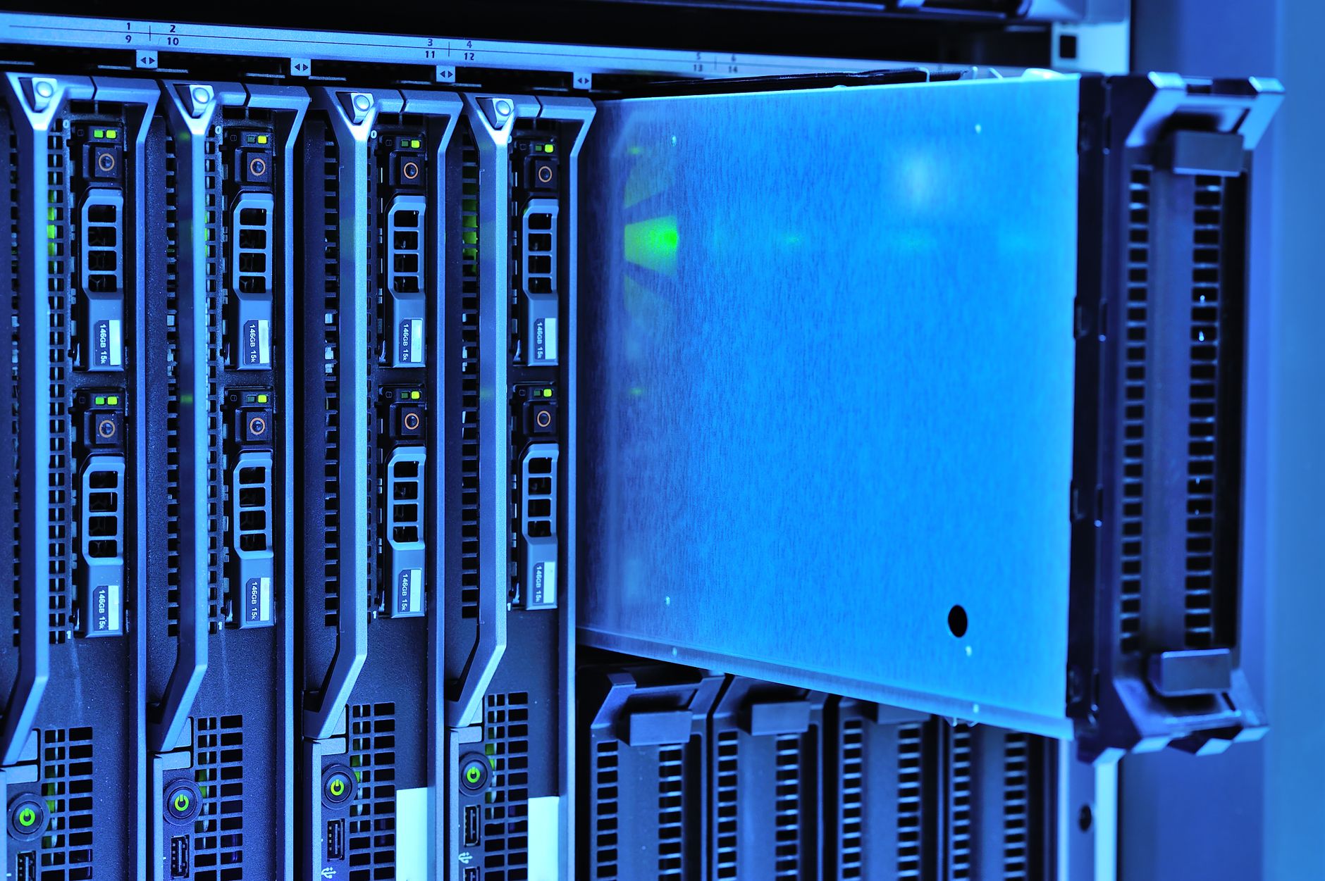 Ilustrasi: Detailed view of server racks with glowing lights in a data center environment.