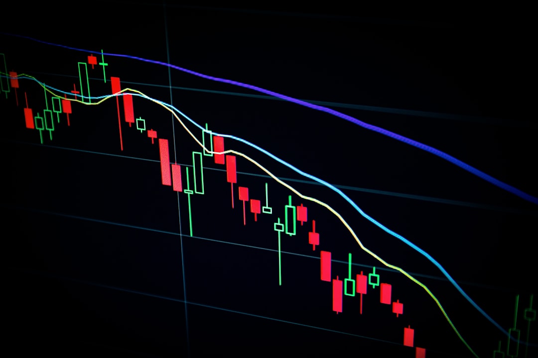 Ilustrasi: Stock market candlestick chart on dark screen